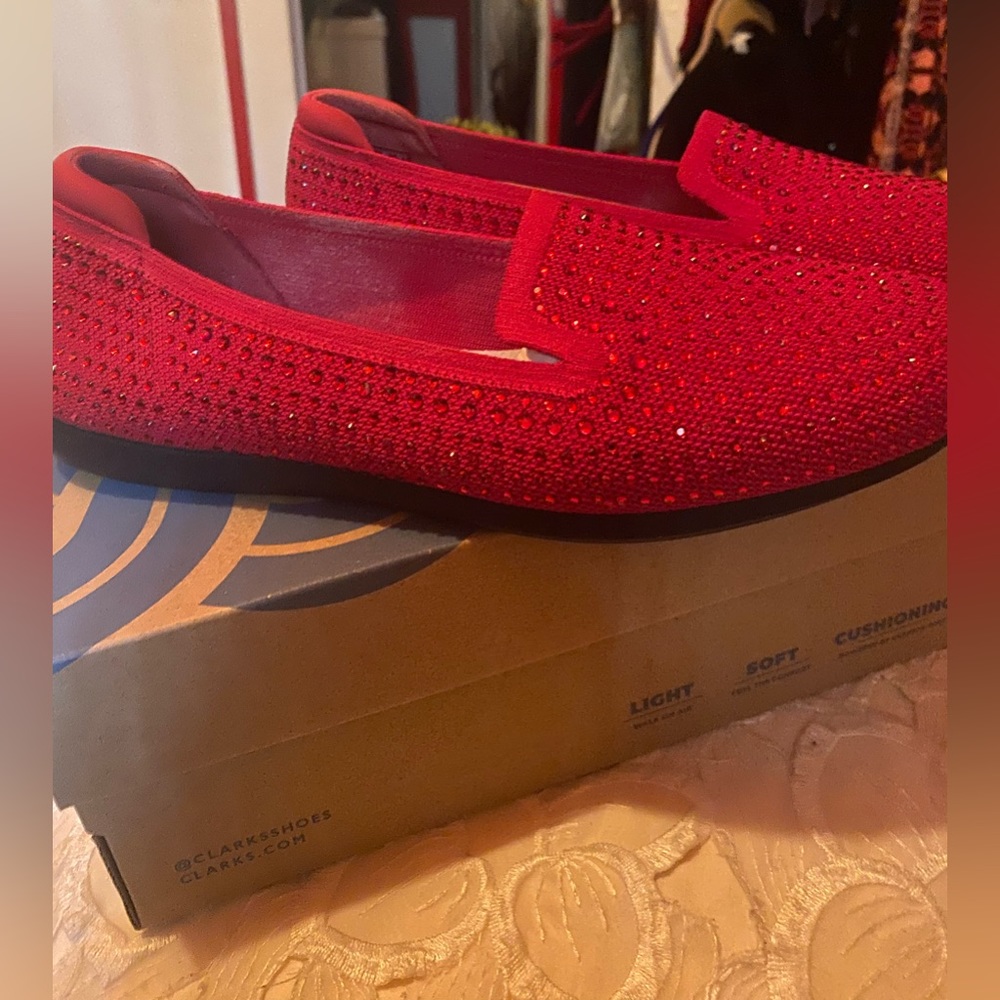Clark's wide width, soft flat red sparkle shoe.